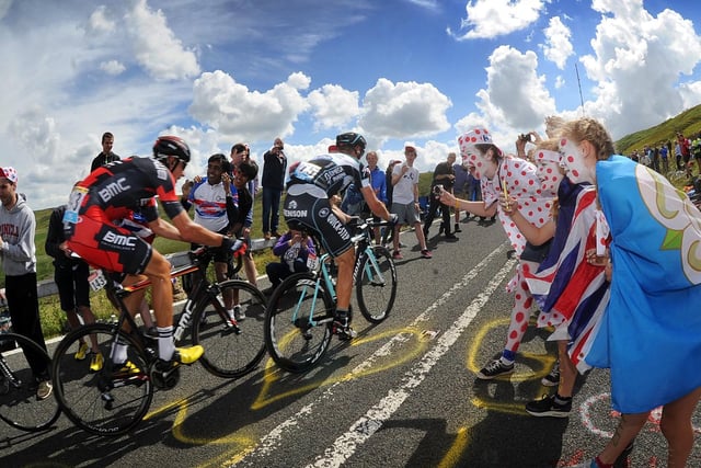 Crowds cheer on the cyclists as they head up the gruelling Holme Moss Climb in the Tour De France. July 2014.