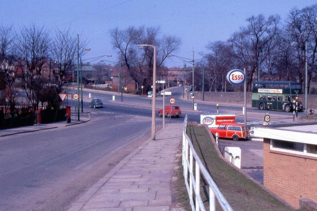 A view looking along Armley Ridge Road to where it crosses Stanningley Road. Armley Grange Avenue is to the left, an ESSO petrol station is to the right.