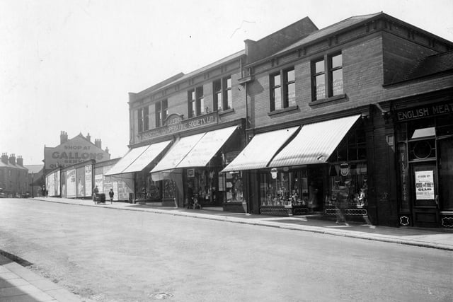 Armley Town Street in the mid-1930s. On the left Gallons grocers shop can be seen with wall sign painted on the gable end.