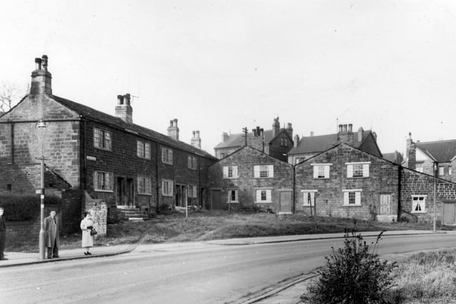 A view of cottages comprising Amen Corner, which was situated at the junction of Armley Ridge Road, Raynville Road and Wyther Lane. The bus stop seen here is on Armley Ridge Road.