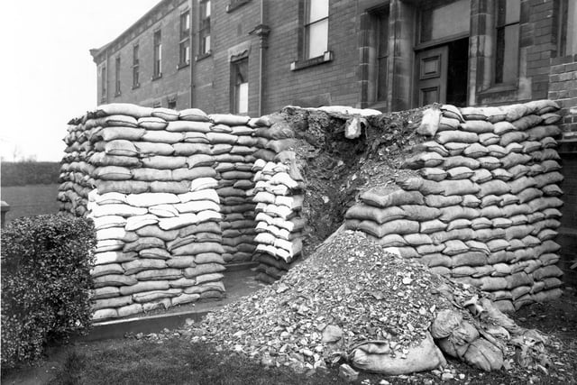 St Mary's Hospital off Green Hill Road.  It was also used as a maternity hospital, then a unit for the elderly. In this view, sandbags which have burst can be seen. This was during the Second World War.