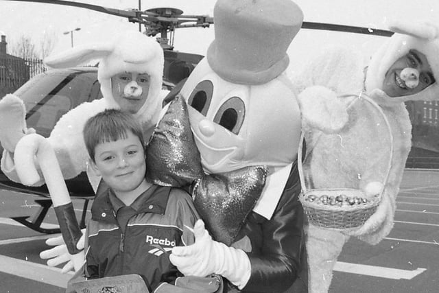 Little Mark Rawcliffe's feet haven't touched the ground since he returned from a dream helicopter flight. His picture of the Easter bunny was picked out from hundreds by judges at the North Lancashire and Preston Blind Welfare Societys, who organised the special Easter competition. Mark, eight, from Kirkham, is pictured with Humpty Dumpty and two Easter bunnies before he was whisked off on his prize trip