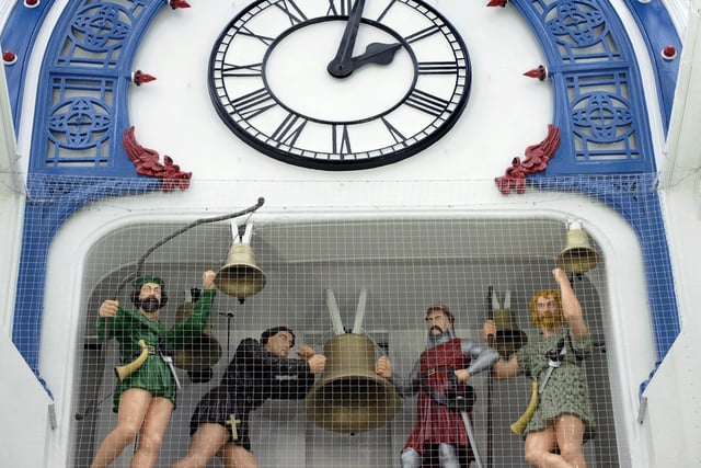 The arcade is distinguished by its clock with moving figures at the Lands Lane end.