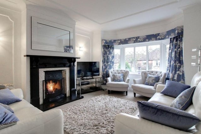 It has a kitchen complete with a large 5-burner gas range cooker and a terraced back garden.