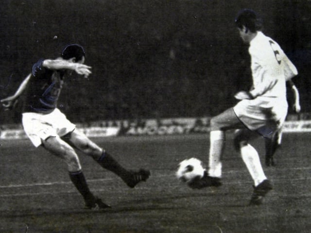 Norman Hunter in a tussle with Florian Albert.
