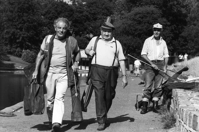 Anglers Henry Pollard (left) and oldest competitor Ezra Naylor, 79, walk to their pegs at Waterloo Lake in Roundhay Park before taking part in the senior citizens angling match.