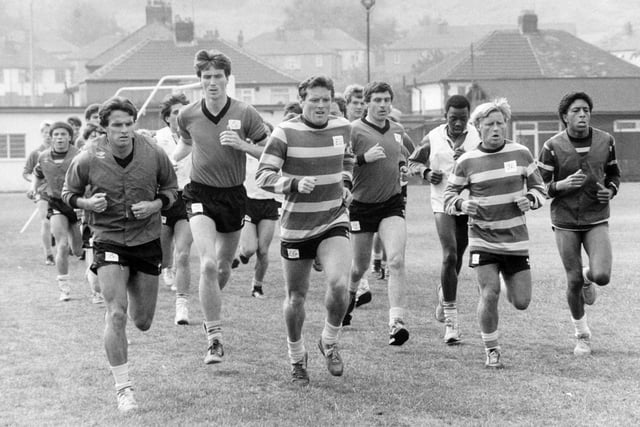 Leading by example. Manager Eddie Gray strides out at the head of the group as Leeds United's players get down to the hard graft of pre-season training.