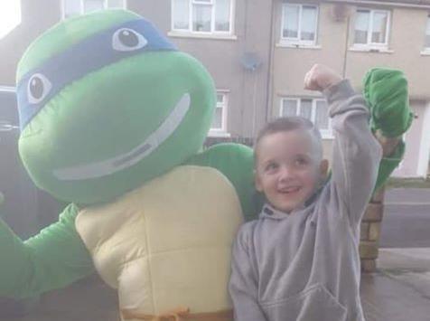 Leonardo the ninja turtle pictured with a happy Pizza Time competition winner.