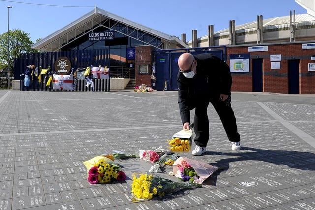 Scowen Skyes lays some flowers. Picture by Simon Hulme.