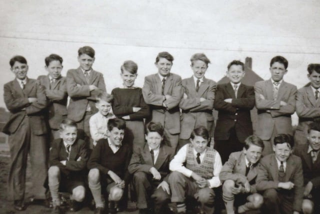 St Joseph's School rugby team attending a party to celebrate winning the Goldthorpe Cup in 1955. This photograph was taken by Peter Jackson outside his home on Belle Isle Road.