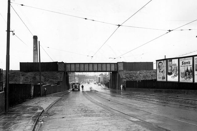 A view looking north to railway bridge over Belle Isle Road, just South of Sandon Place. 'C.W.S' chimney is to the left.