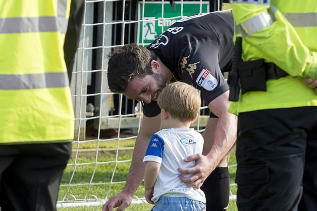 Will Grigg with a young fan.