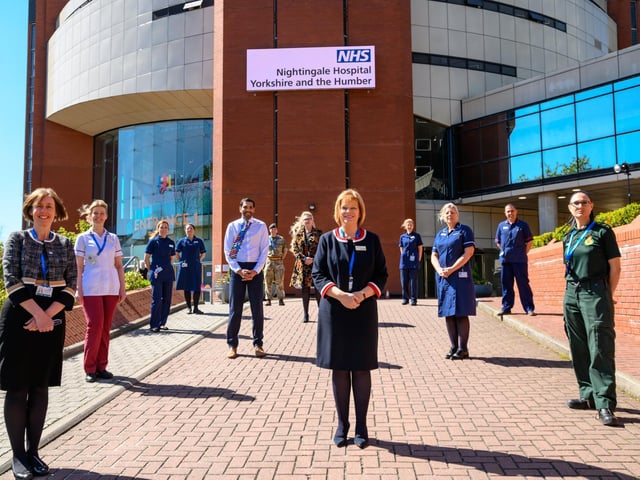 Pictures of the NHS staff recruited to run the new Nightingale Hospital in Harrogate outside the hospital at today's opening led by Chief Nurse Amanda Stanford and Medical Director Yvette Oade
