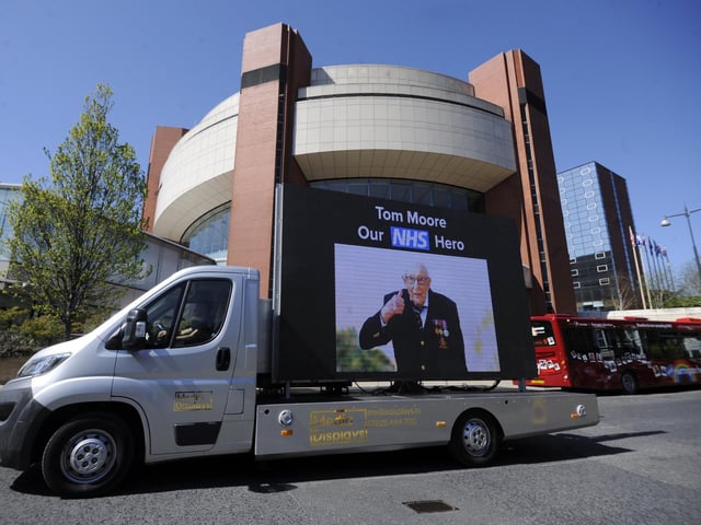 A screen which reads: "Tom Moore - Our NHS hero."