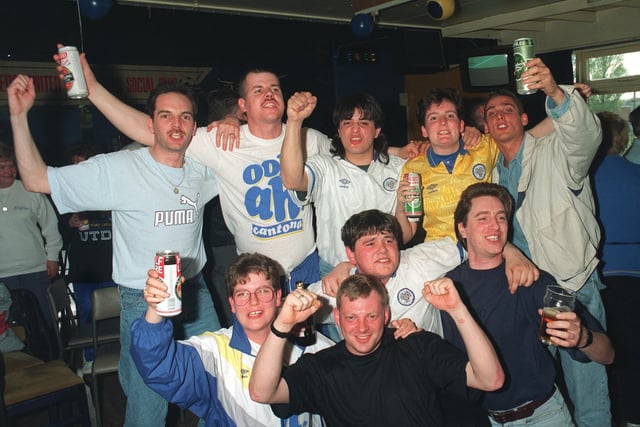 Supporters enjoy a few cans as they celebrate title glory.