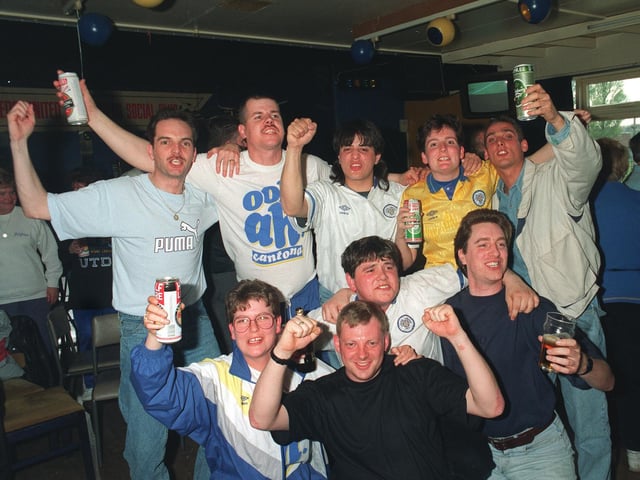 Supporters enjoy a few cans as they celebrate title glory.