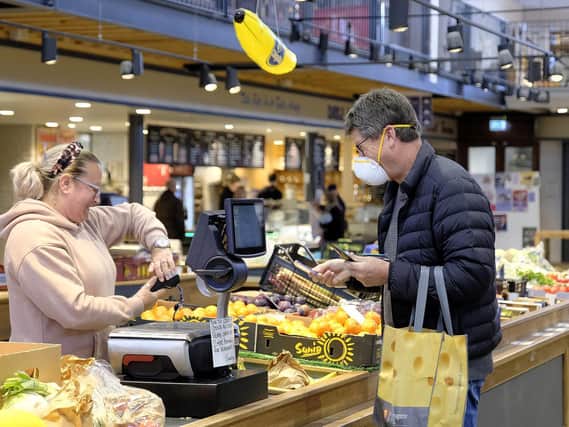 The market hall is open for food shopping, with every safety measure carefully in place, and many traders have introduced home delivery for the first time