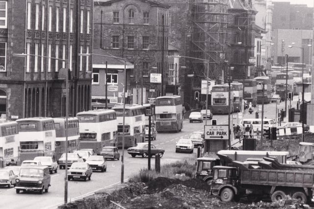 We counted 12 buses on Wellington Street in this photo.