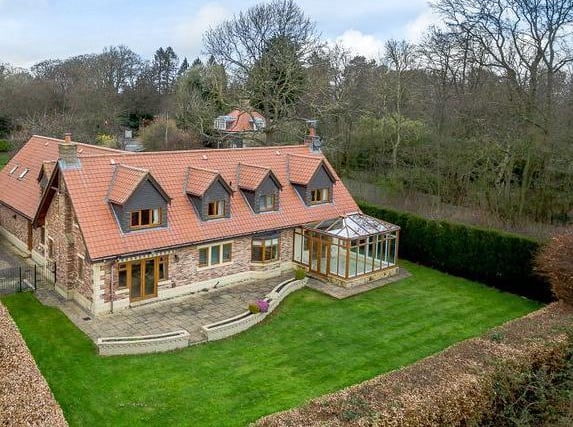 This five bedroomed detached property is located just a mile from Harrogate town centre, backing onto open fields and rolling countryside. This is up for sale with Strutt & Parker for 925,000.