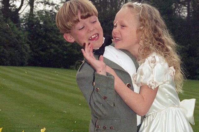 Scores of brides-to-be packed out Preston's Marriot Hotel for their popular annual wedding fayre. Pictured above Keaton Dickinson, eight, and his sister Lucinda, seven, of Lytham, modelling wedding clothes for the fayre