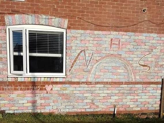 Sharon Baxter sent in this picture of the colourful work chalked on the side of her neighbour's house that made her smile. It was done by young Lewis and Leah Joynes from Kippax, who spent three days thanking the NHS for all their hard work with their colourful art work.