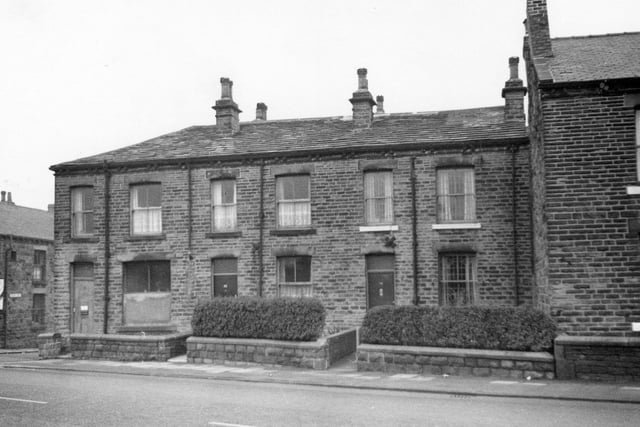 A view of terraced houses on Bradford Road. To the left is the junction with Fenton Street.