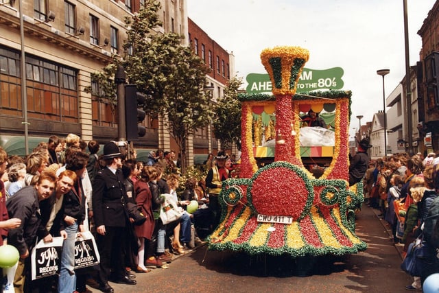 Lewis's decorated float as it 'steams' up the Headrow past Lewis's department store, seen left. 300,000 people turned out on the blustery, showery June day to watch the 7th Lord Mayor's Annual Parade