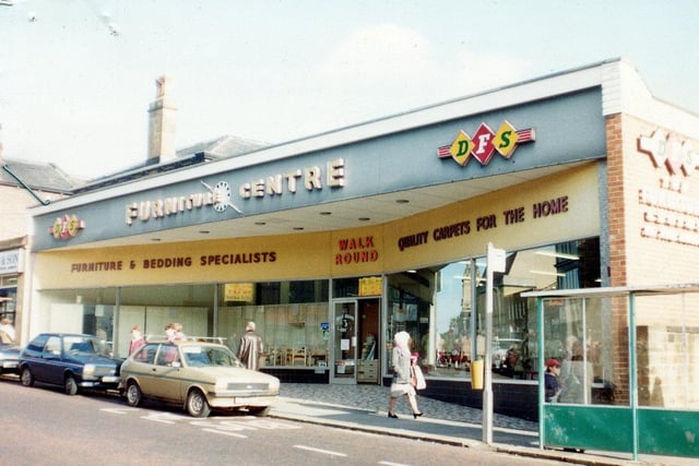 Direct Furniture Stores 'Furniture Centre' on Queen Street in Morley. Next door, on the left, is Norman Tempest & Son, Auctioneer, Valuer and Estate Office.