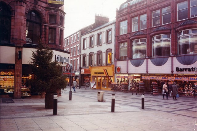 Commercial Street, right, at the junction with Lands Lane, left. The area was pedestrianised in the 1970s. On the corner, left, is Collingwood Jewellers and  Barratts shoe shop is at the right edge.