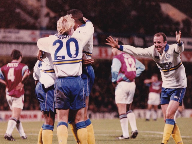 Gary McAllister races into join Kevin Sharp in congratulating goalscorer Rod Wallace.