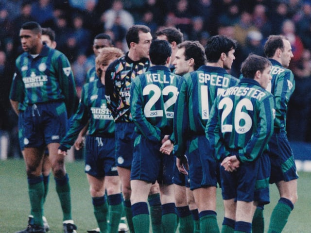 The Leeds players turn to try and quieten their supporters during the one minute 'silence' for Sir Matt Busby.