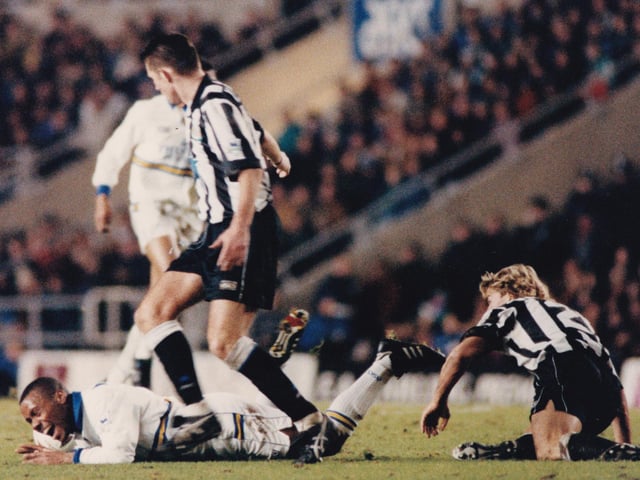 Rod Wallace crashes to the ground after a challenge from Newcastle's Barry Venison.
