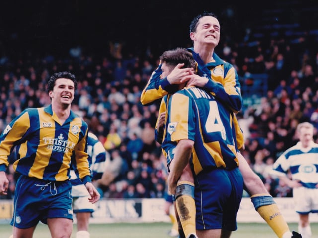 David White is jumped on by Gary Kelly at Loftus Road as he celebrates his first league goal for Leeds United.