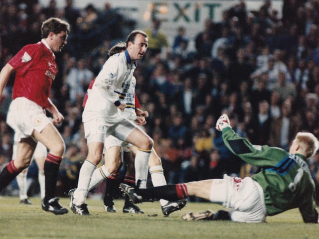 Peter Schmeichel spreads himself to deny Gary McAllister in front of 41,125 fans at Elland Road, the biggest home attendance of the season.