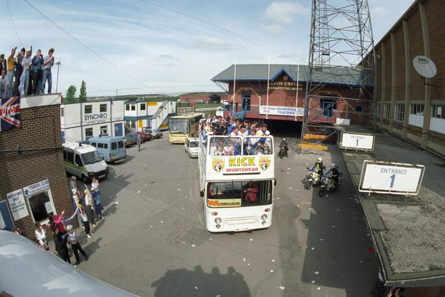 The open top bus leaves Elland Road.