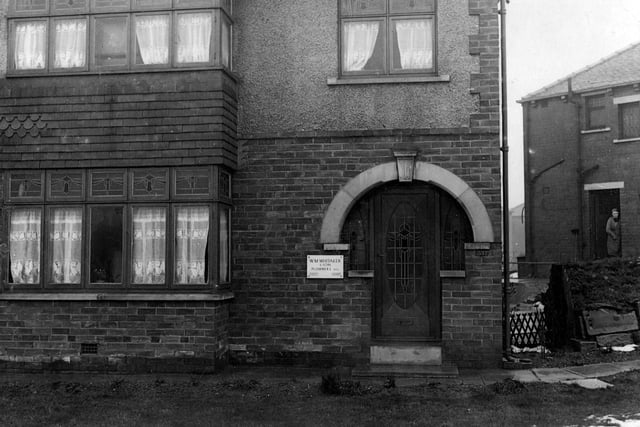 View of 537 Dewsbury Road in Middleton which was the residence of W.M.Whitaker, plumber. An Anderson air-raid shelter can be seen on right of the photograph.