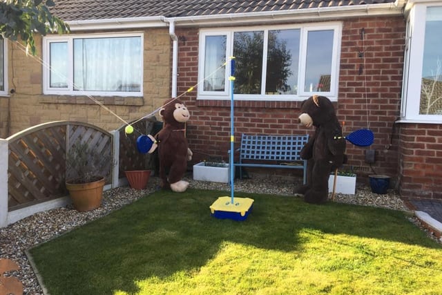 The bear and monkey enjoy activities in the garden in Calverley.