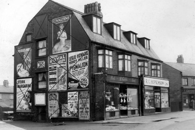 Advertising hoardings (crossed through) on the side of Gibbs butchers at Middleton Park Circus. There is a good view of the butchers' window. Also in view is Hopkinson's Grocery and part of Gatenby's the greengrocer.