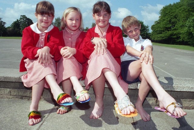 Children as young as eight are being introduced to the world of industry. Youngsters from Euxton St Mary's RC Primary have been spending one hour a week learning about the great world of work. And these four have created their own shoes as part of the school industry link project