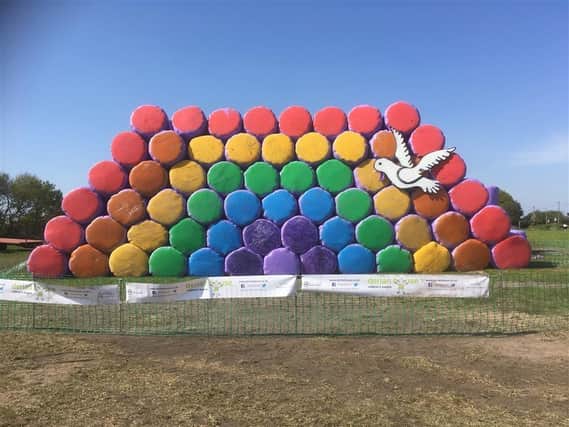 A farmer in Chorley has created a rainbow scene out of hay bales to help raise funds for Derian House Children's Hospice