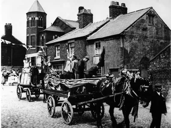 Poulton Whit Walk in the early 1900s passing the old Methodist Chapel on the corner of Chapel Street. The cottages still remain, but the chapel was demolished in 1964 after 150 years of Methodism in the town.