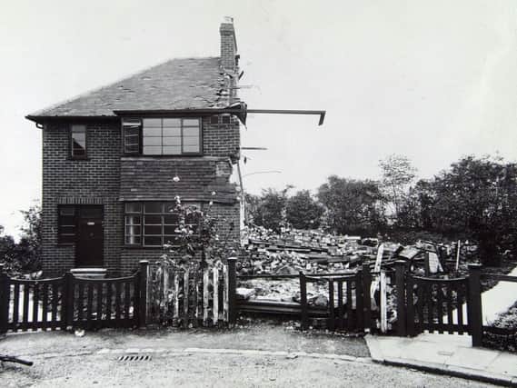 A semi-detached house is levelled by bombing in 1941 with just its guttering surviving.
