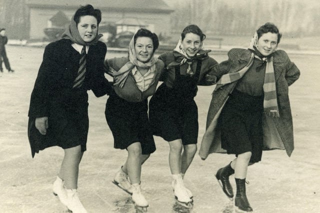 Elmslie Girls School pupils Pat Howarth, Betty Taylor, Mavis Jones, and Margaret Jones ice skating on Stanley Park Lake in 1946.