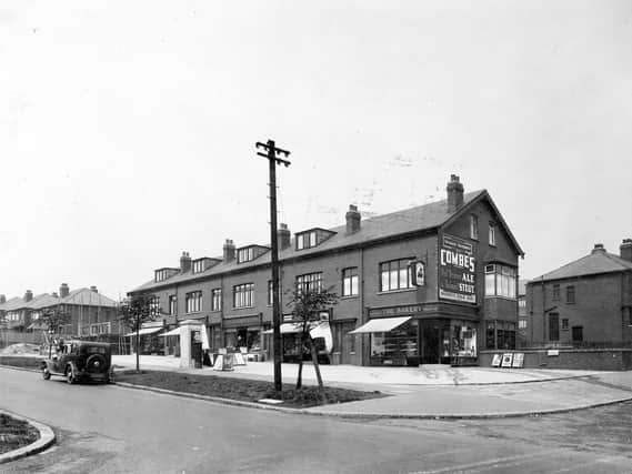 A row of shops on Easterly Road, looking from the junction with Gipton Wood Road. The parade of shops are includes F.A Robson chemists, Beaumonts fruit shop and a bakery on the corner