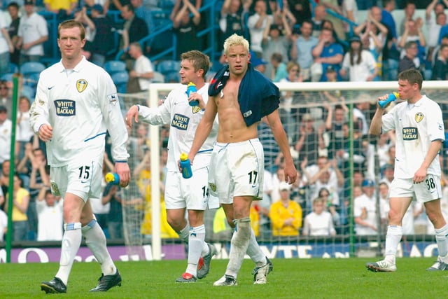 A dejected Steven Caldwell, Stephen McPhail, Alan Smith and James Milner walk off at the final whistle.
