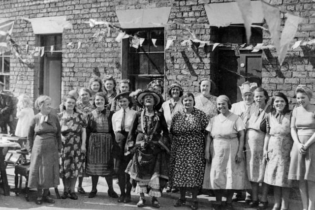 West Place party, off Longwestgate (now demolished). In the centre is Old Town character Alice Pashby, well known for dressing in long frilly knickers.