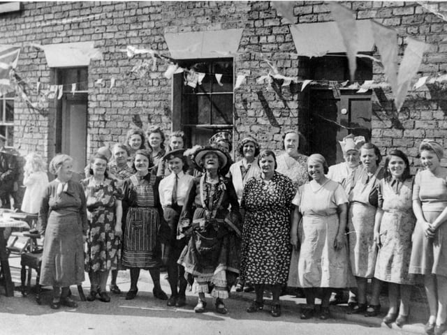 West Place party, off Longwestgate (now demolished). In the centre is Old Town character Alice Pashby, well known for dressing in long frilly knickers.