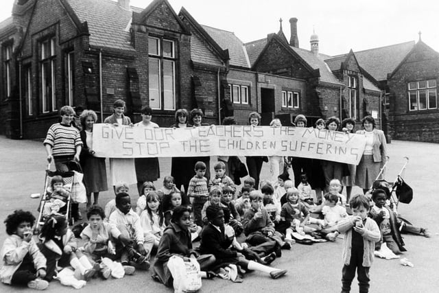 Mothers staged a playground protest at Westfield Primary on Burley Road after they were refused permission to supervise their children's lunch breaks. Teachers were refusing to supervise meals as part of their dispute over pay.