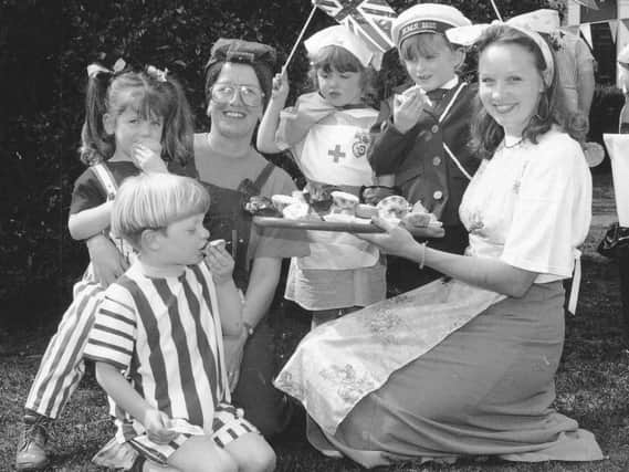 Tucking into cakes at Childhaven Nursery's street party are Matthew Brown, Katie Doubtfire with mum Eileen, Cleo Sayers, Samantha Gray and nursery nurse Tracey Anderson.
