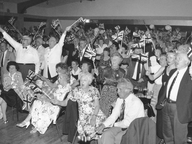 Waving the flags for Land of Hope and Glory at A Night To Remember concert at Scarborough Spa.